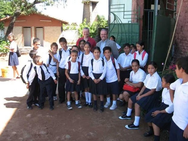 The author (gray blazer) with students in Paraguay. (Photo courtesy of Paul “Greg” Smith) The author (gray blazer) with students in Paraguay. (Photo courtesy of Paul “Greg” Smith)