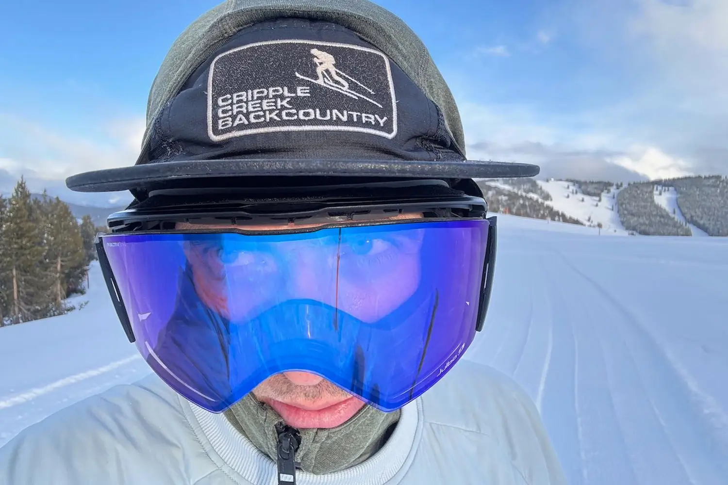 Person wearing Person with Julbo Cyrius Googles in snowy conditions,