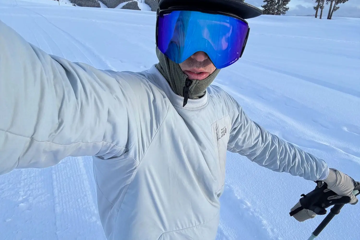 Skier wearing Person with Julbo Cyrius Googles in snowy conditions