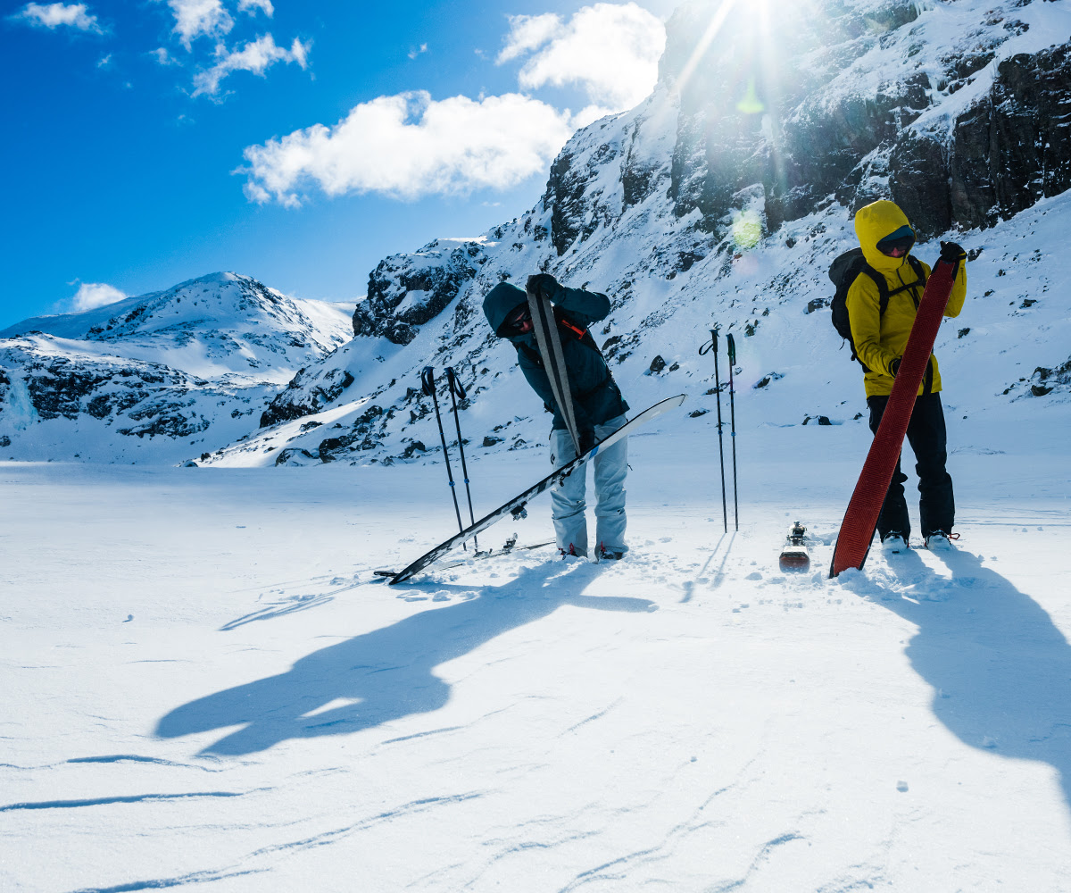 Backcountry Skiers Putting on Black Diamond Skins