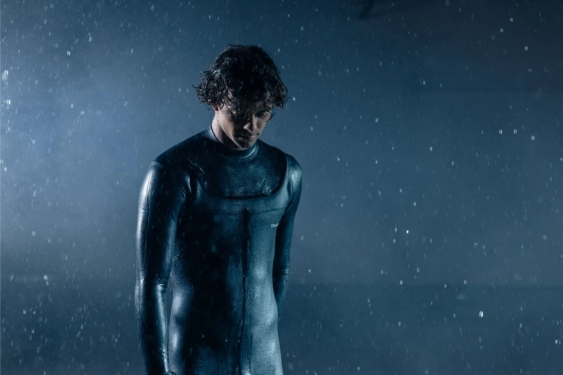 Man in wetsuit in rain