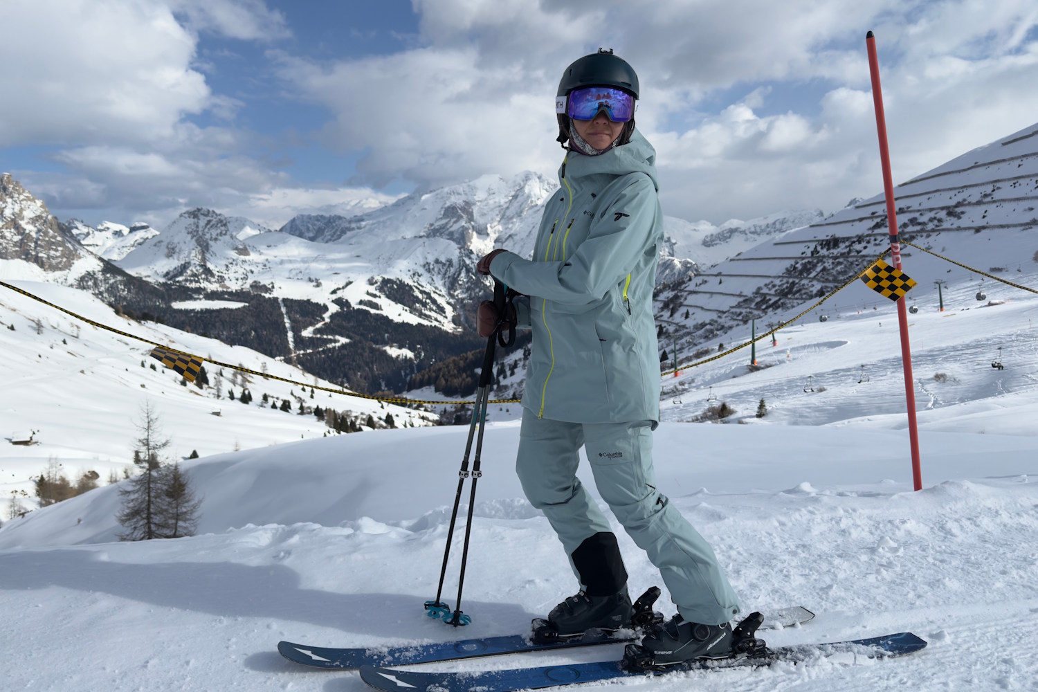 Woman standing in snow wearing columbua platinum peak II shell jacket