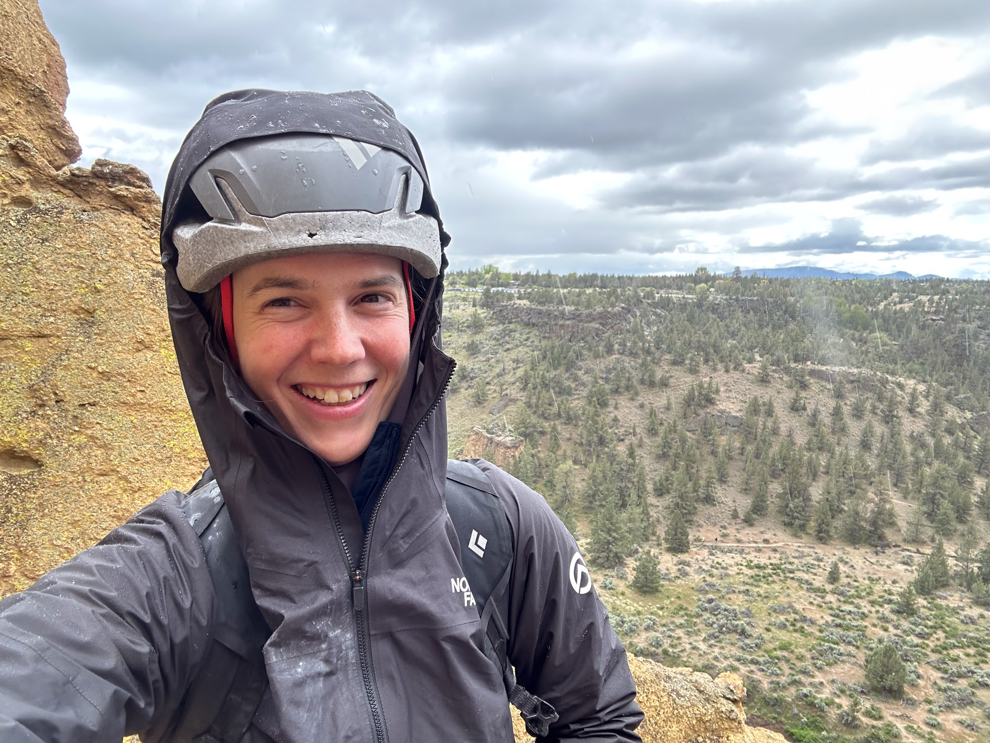 the author wearing the papsura rain jacket in smith rock state park in oregon