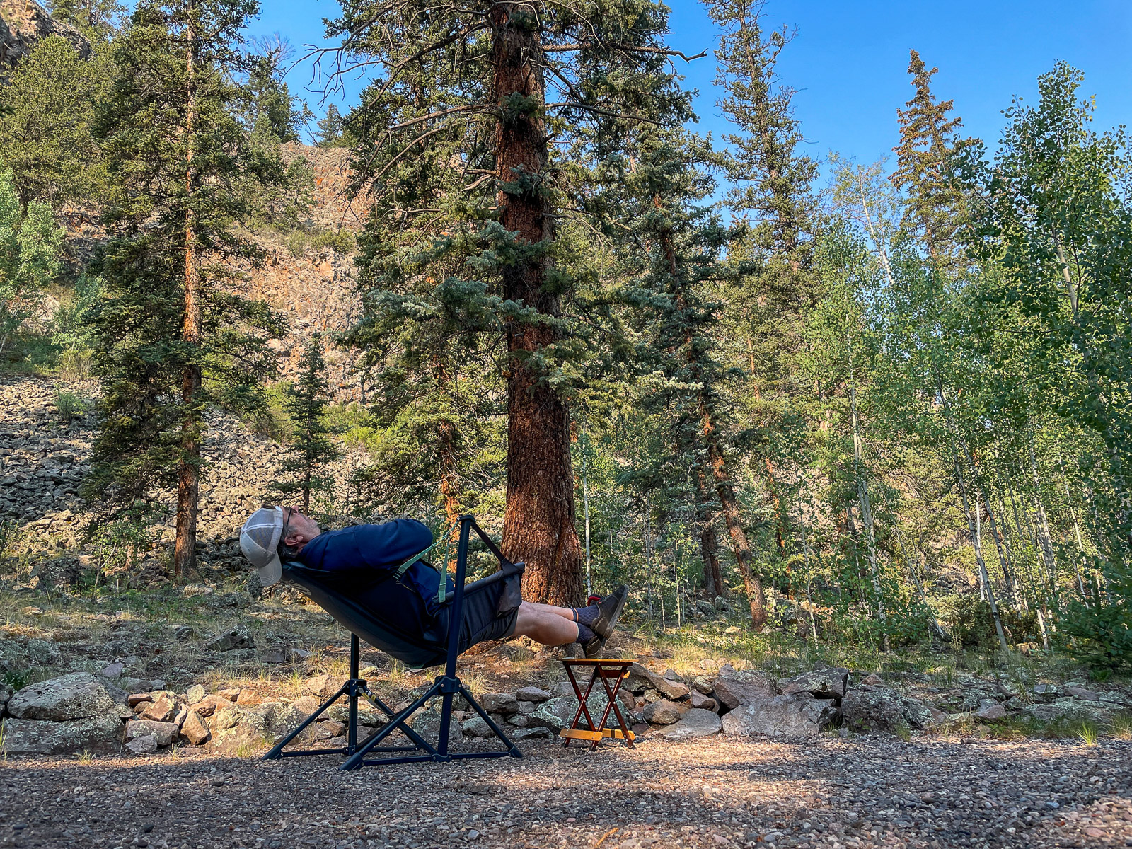 a camper kicks back in the stargaze evo-x