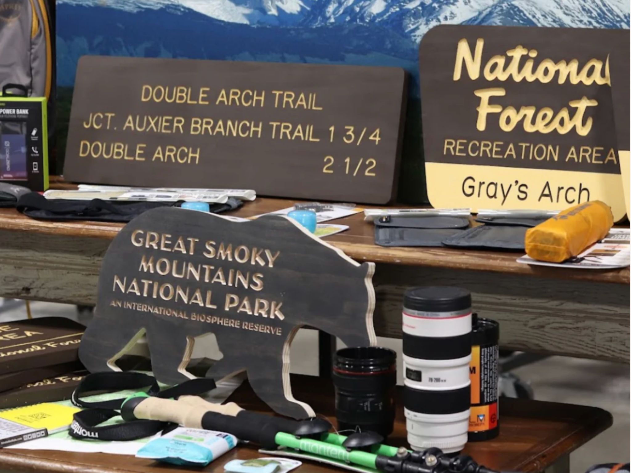 Outdoor gear shop display with signs and camera