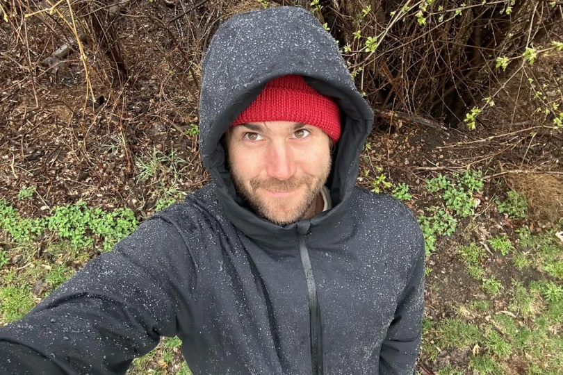 man taking selfie wearing teren campfire puffy jacket in rain