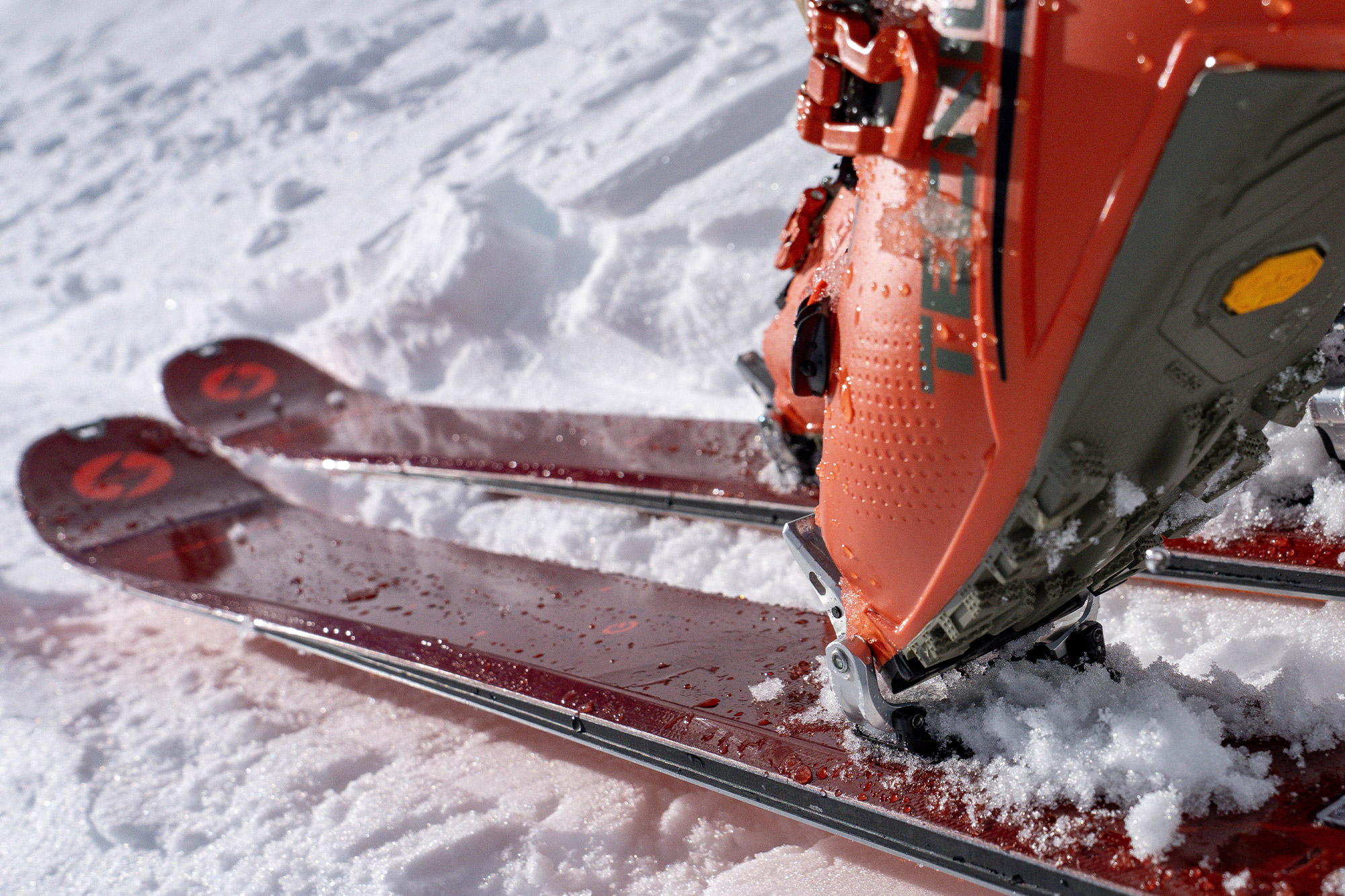 Detailed view of the Blizzard ski surface showing the top sheet texture and binding.
