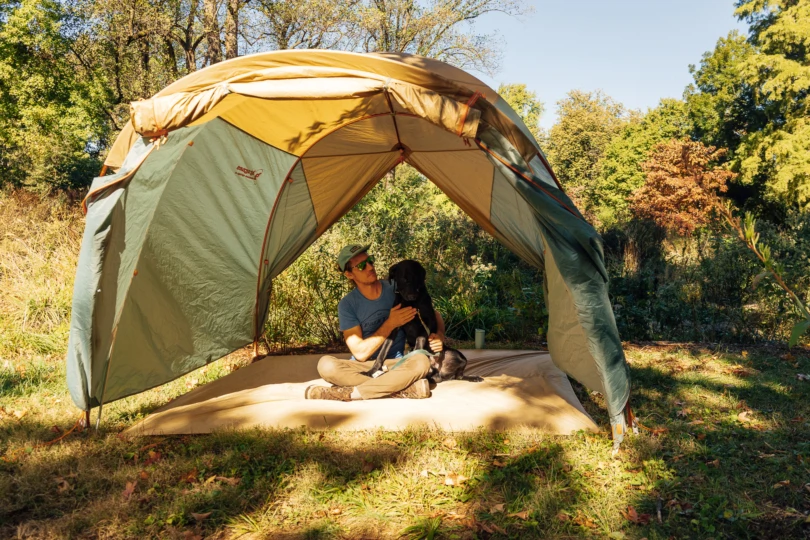 Relaxing under the vestibule shade with a dog