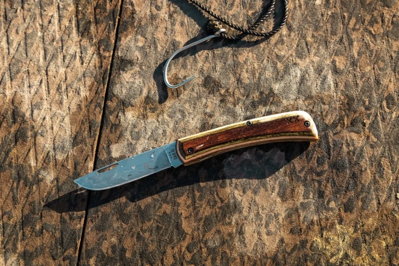 case knives XR Sod Buster jr crossroads knife on a dock