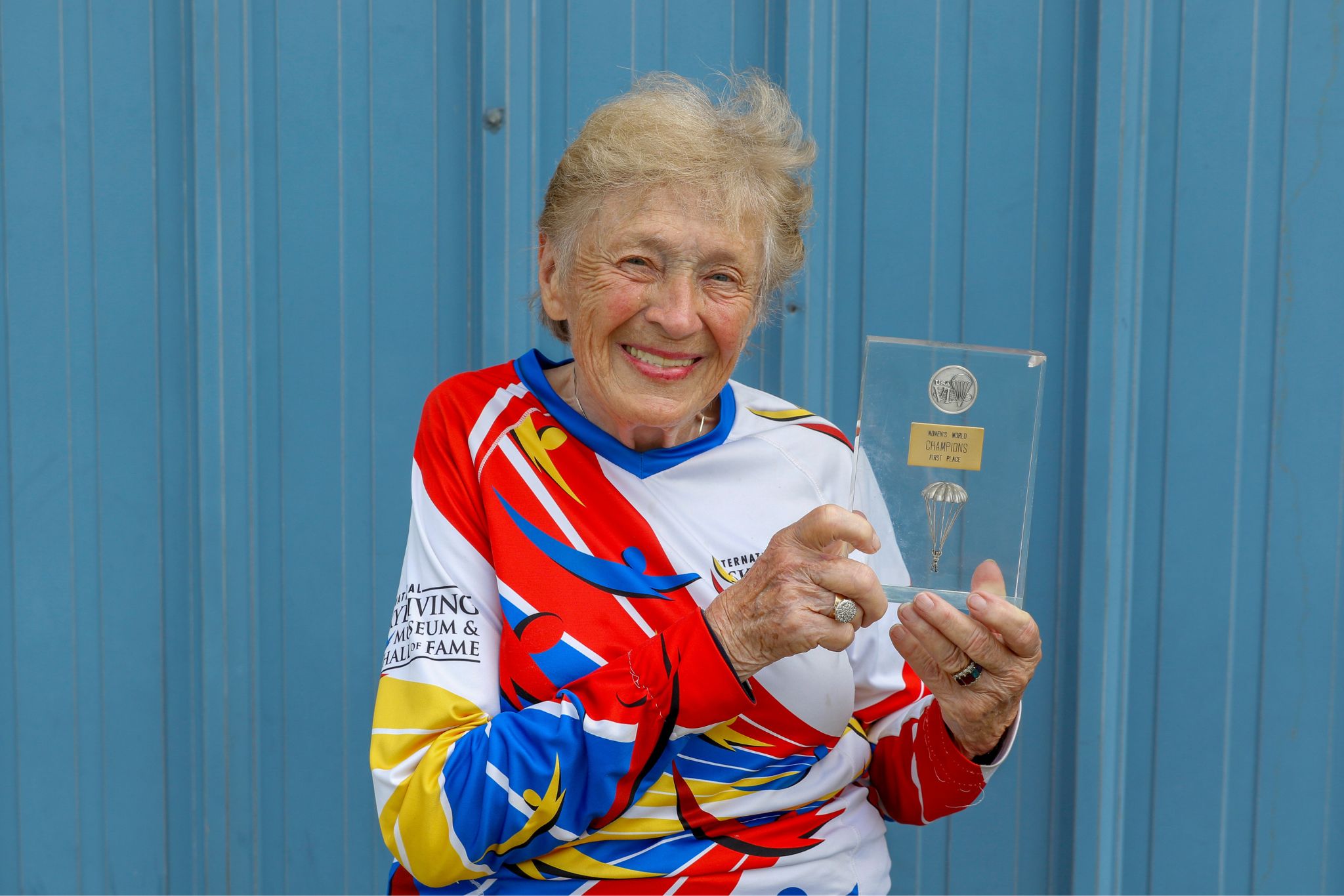 Woman poses with award