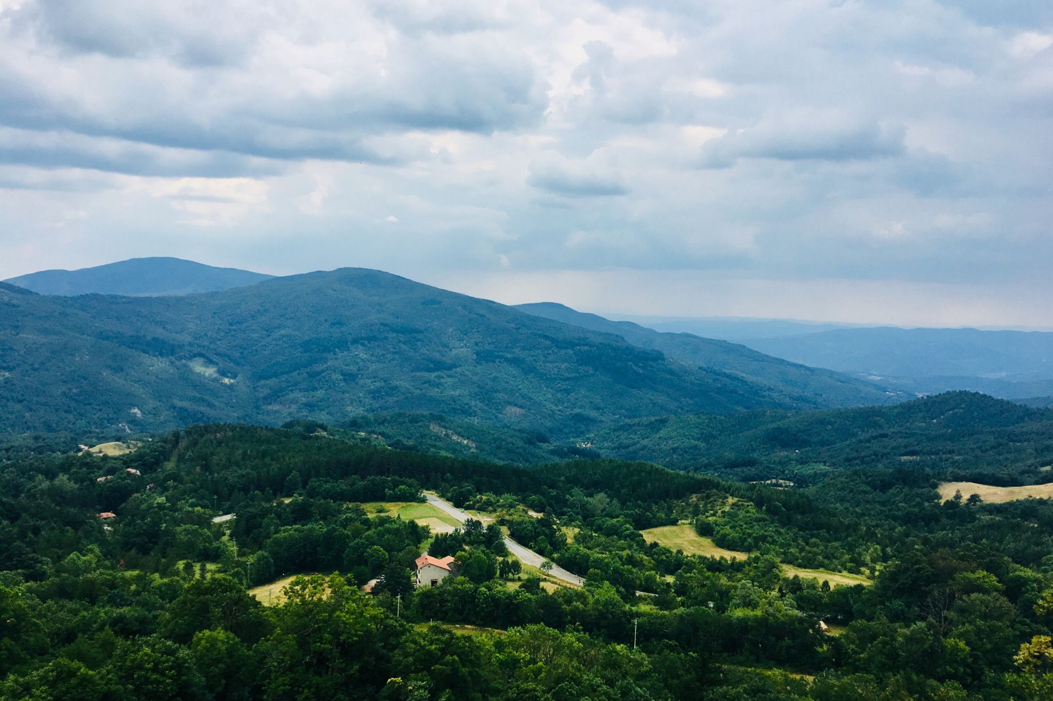 View of valley with trees and mountains