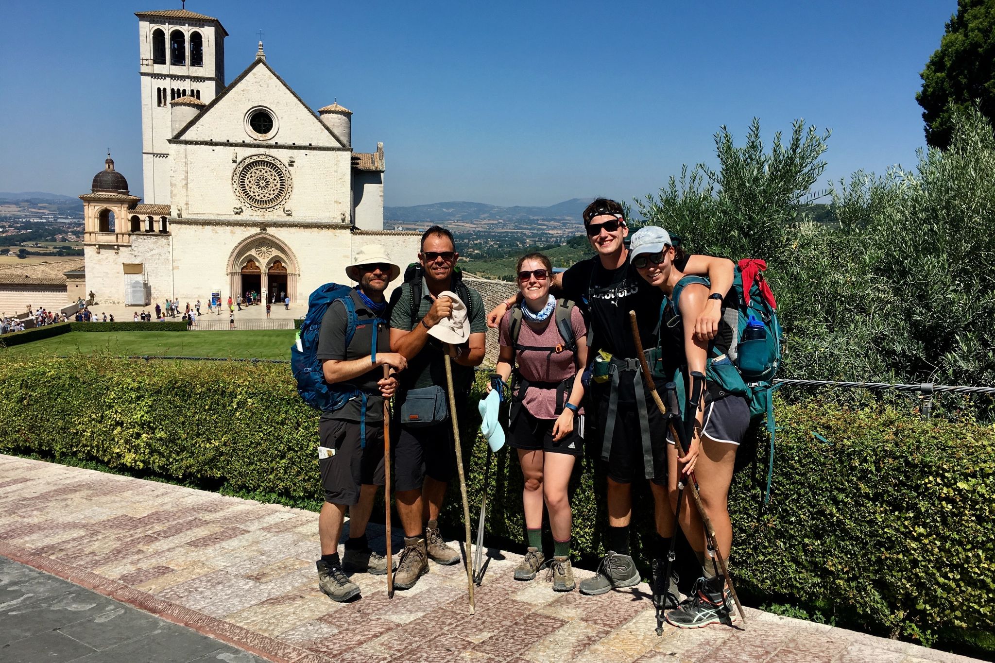 A group of hikers in front of a church