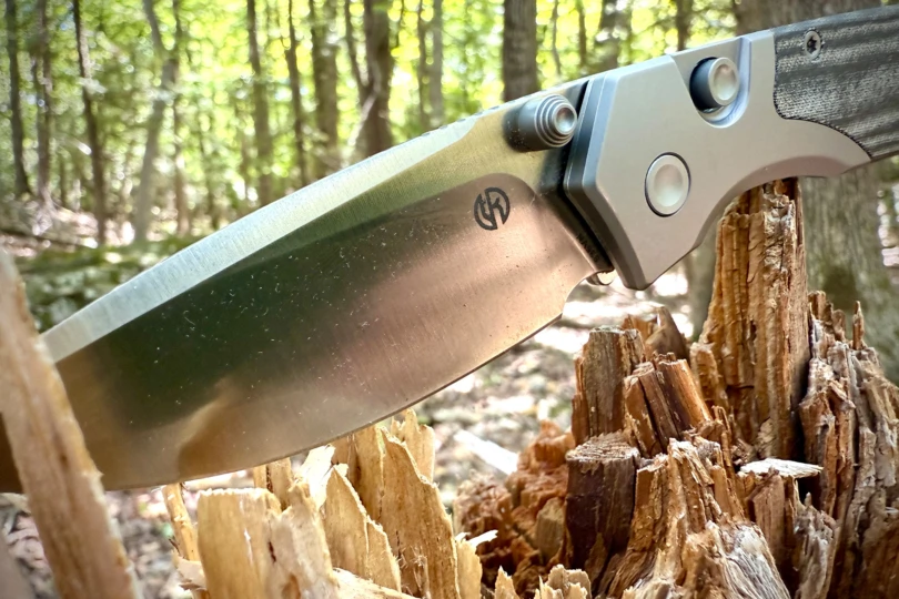 The Vosteed Psyop 299 blade caught in sunlight, showing a clean edge and logo