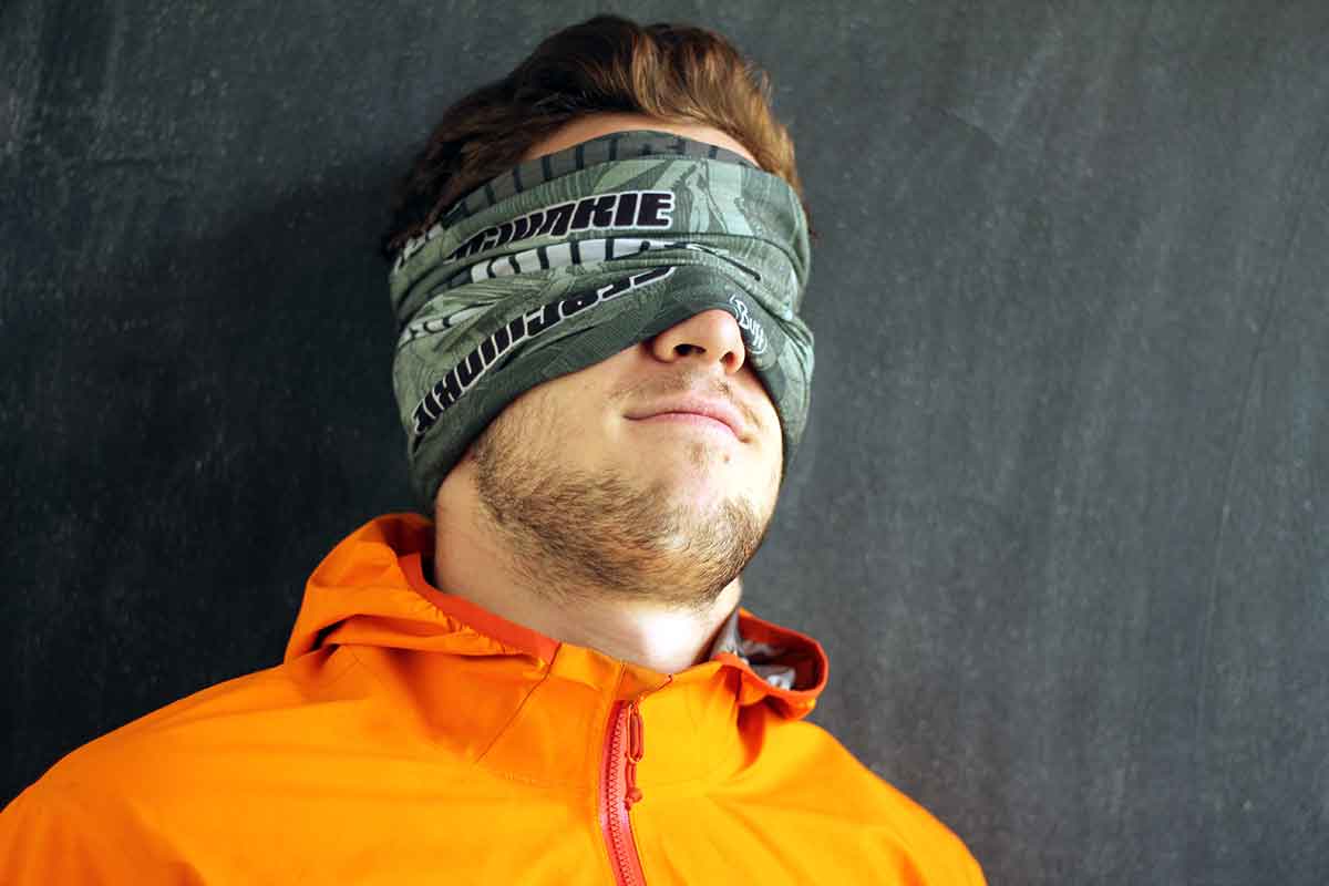 person weating buff as eye mask