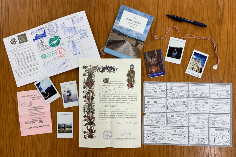 A collection of certificates, photos, and keepsakes from completing the Camino pilgrimage
