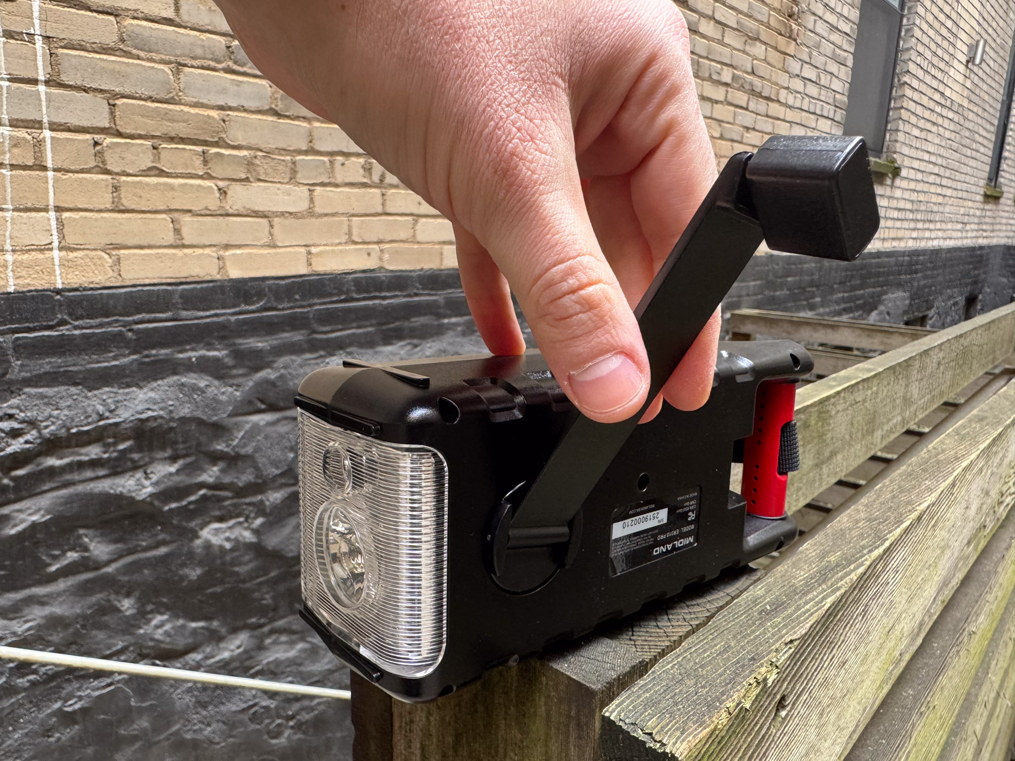 the author demonstrates the hand crank on the weather radio