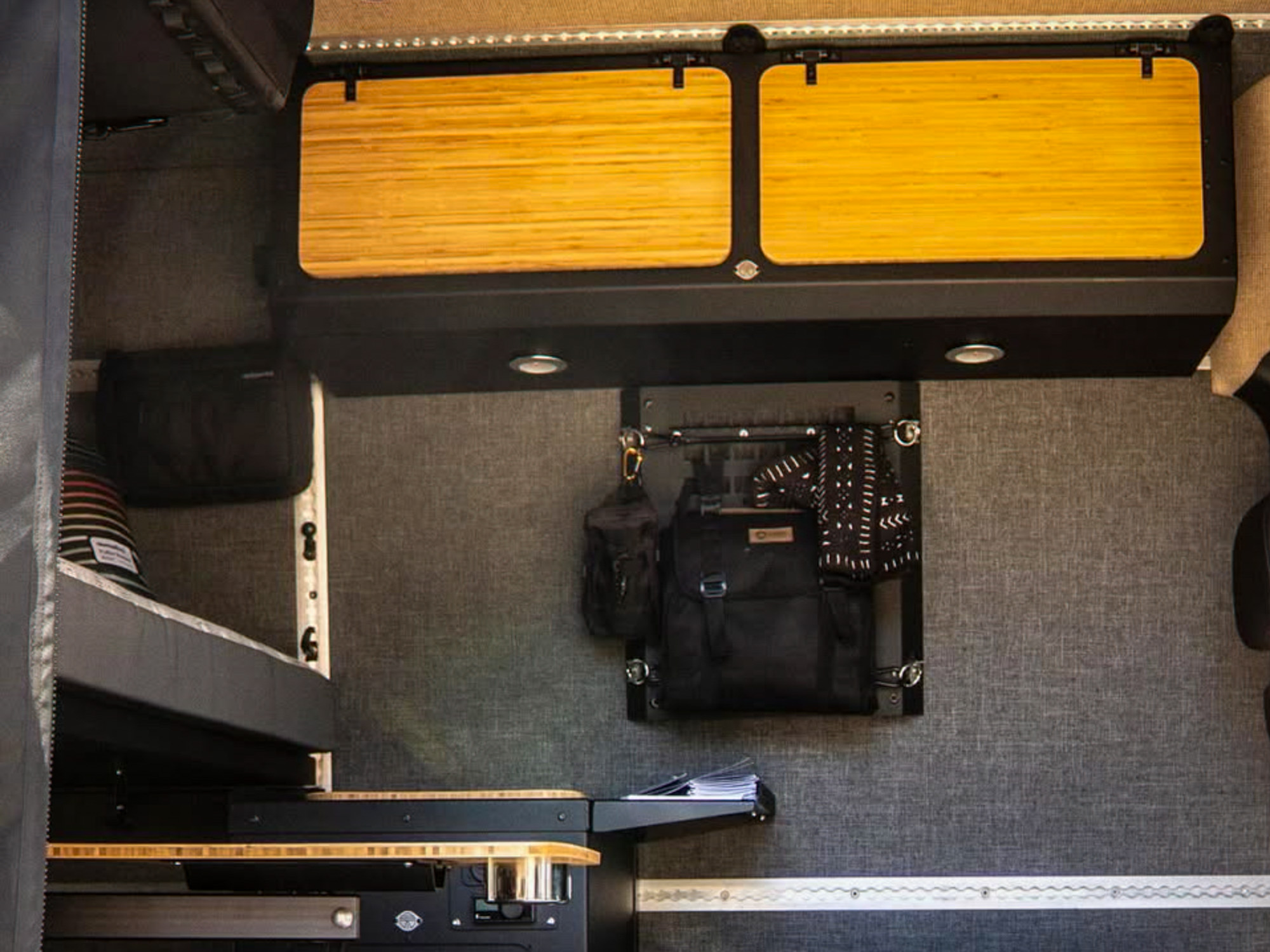 Lost Hiway campervan Foundation Kit with cabinets, bed, and Lagun table attached to L-track