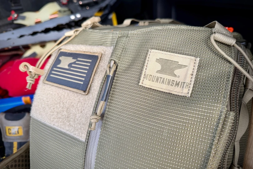 Close-up of the Mountainsmith Mayhem EVO 30L Backpack showing the logo patch and front fabric