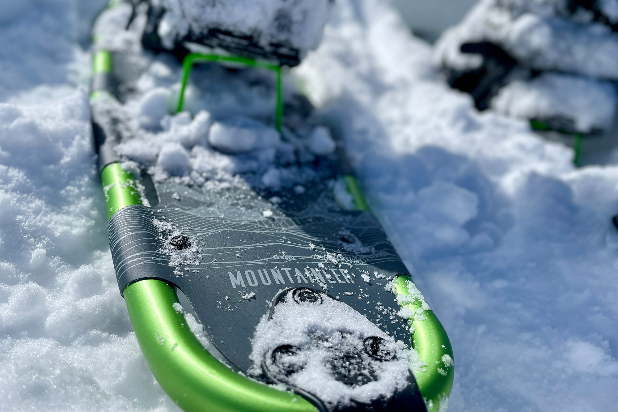 Tubbs Mountaineer frame and deck visible in the snow
