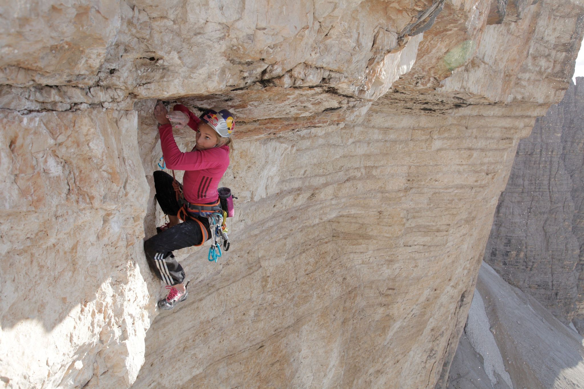 Woman climbs under roof outside