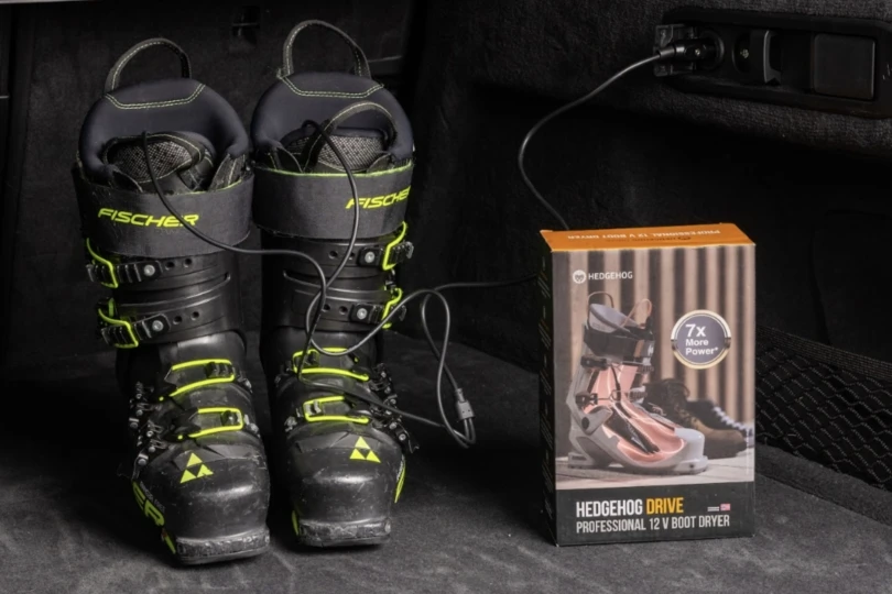Ski boots next to package of boot dryer