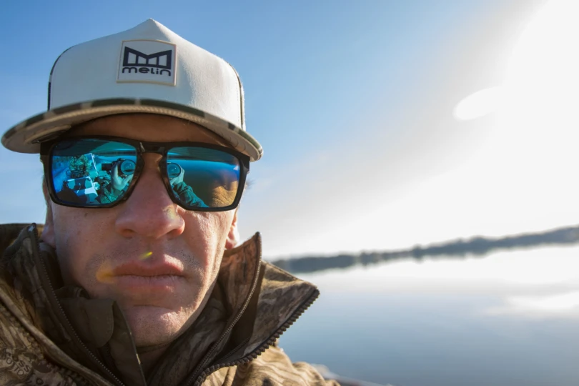 A selfie of an angler wearing the WileyX Apex on a boat