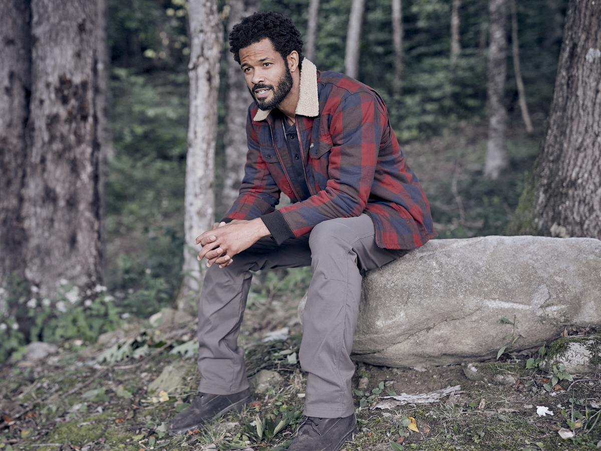 Man Sitting on Boulder Wearing ATG by Wrangler Sherpa Lined Flannel Shirt Jacket