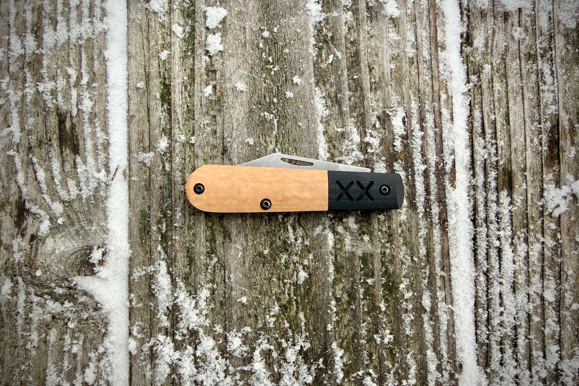 The Case Crossroads Barlow XR Knife closed and centered on weathered wood with snow