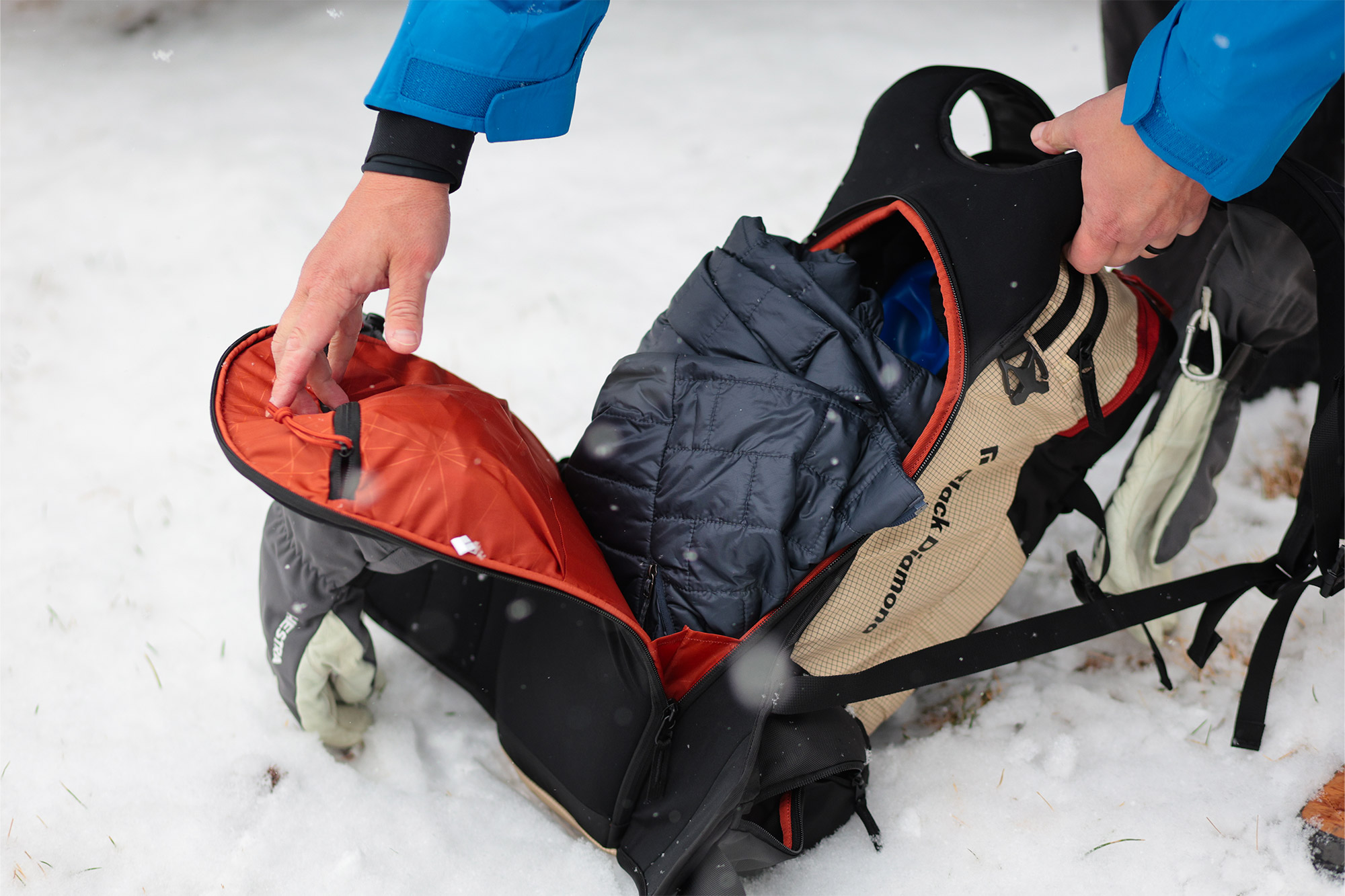 The main compartment of the Dawn Patrol 25 pack open with a jacket inside