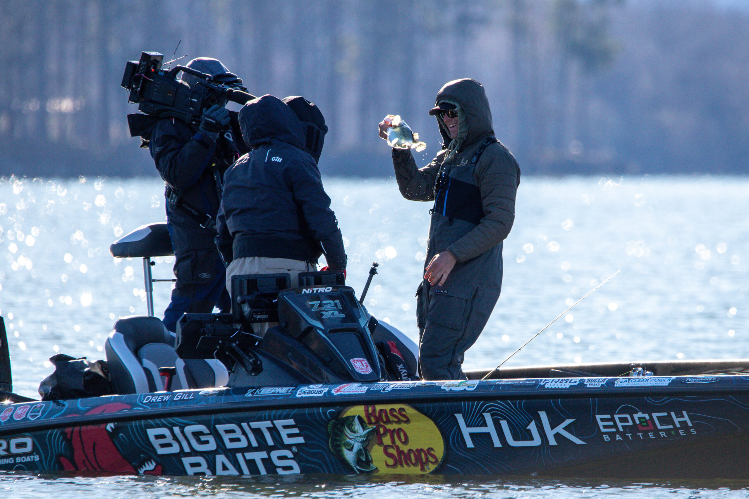 Drew Gill holding a bass in front of the camera during MLF Stage One.