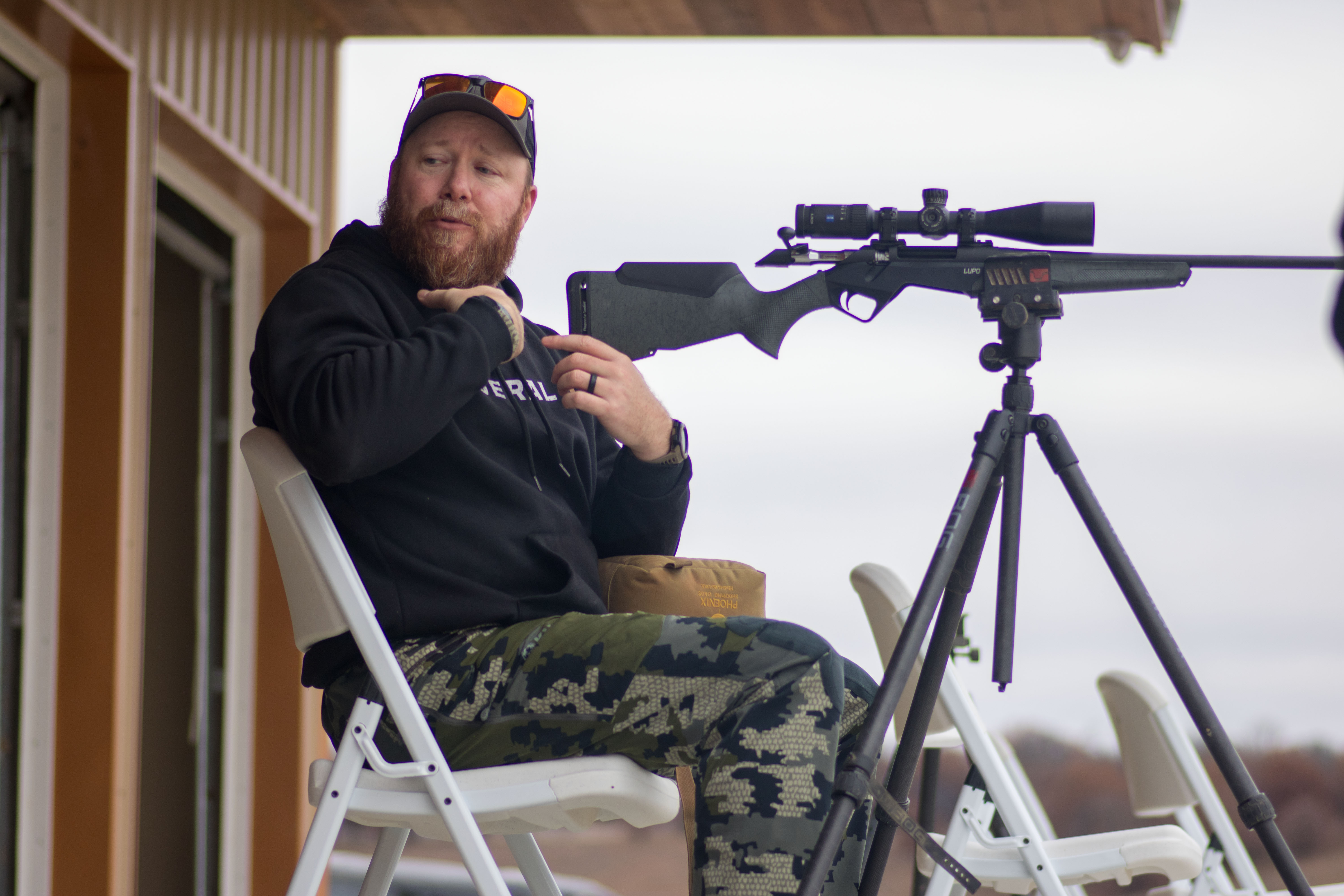 A shooting instructor provides instruction on proper form at a Field to Table Experience with Outdoor Solutions.