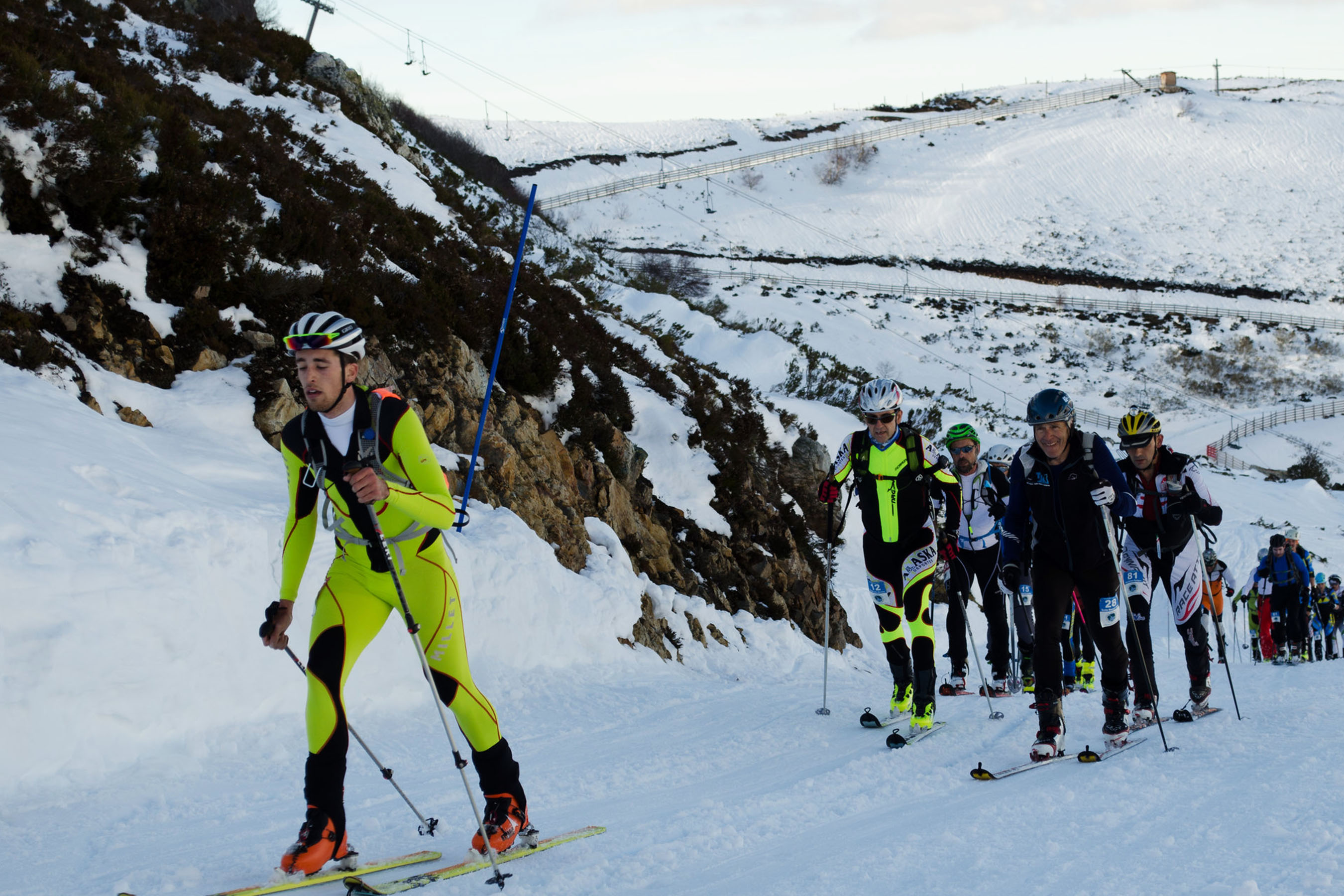 skimo skiers in race along a course