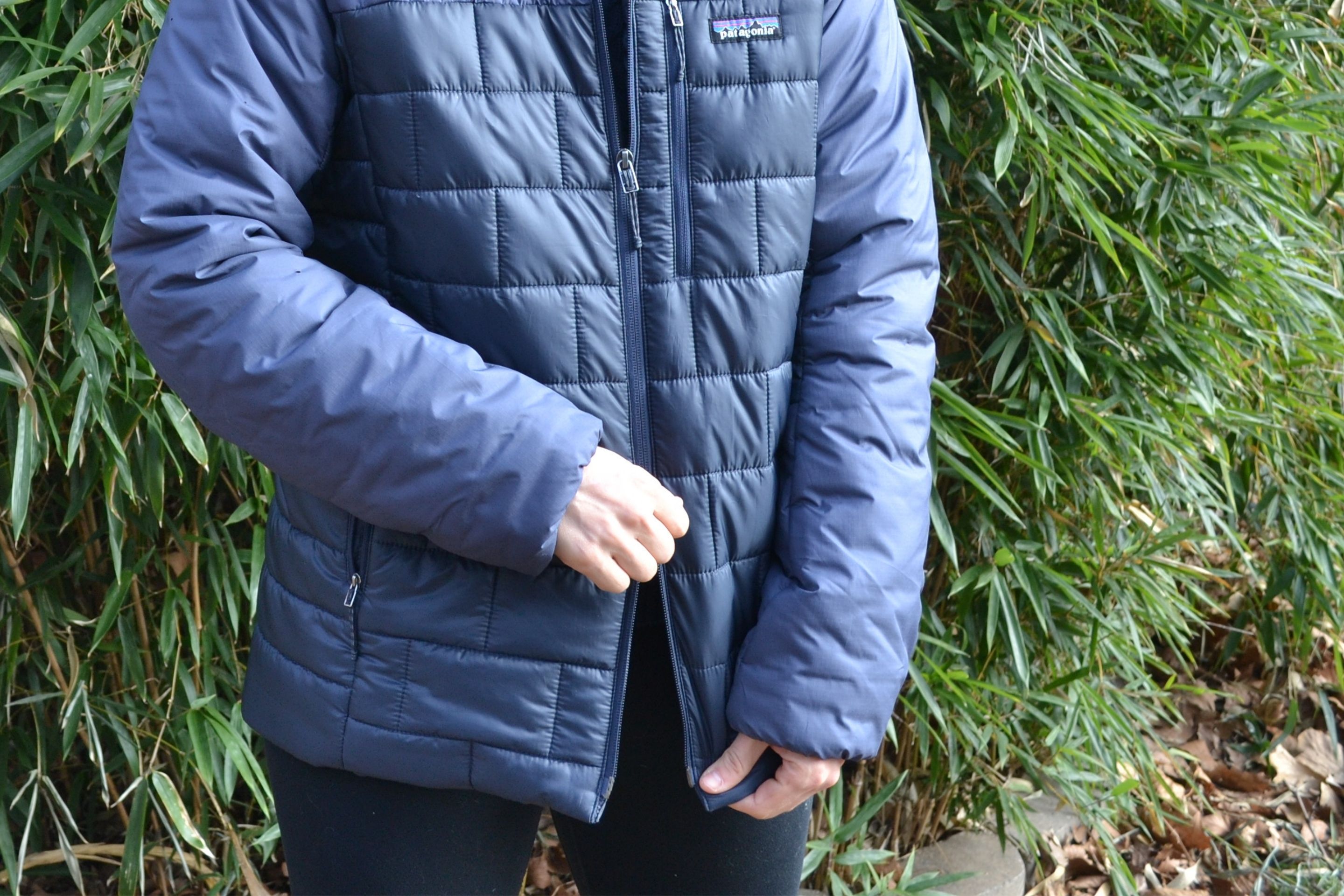 Close up shot of two-way zipper on blue down jacket