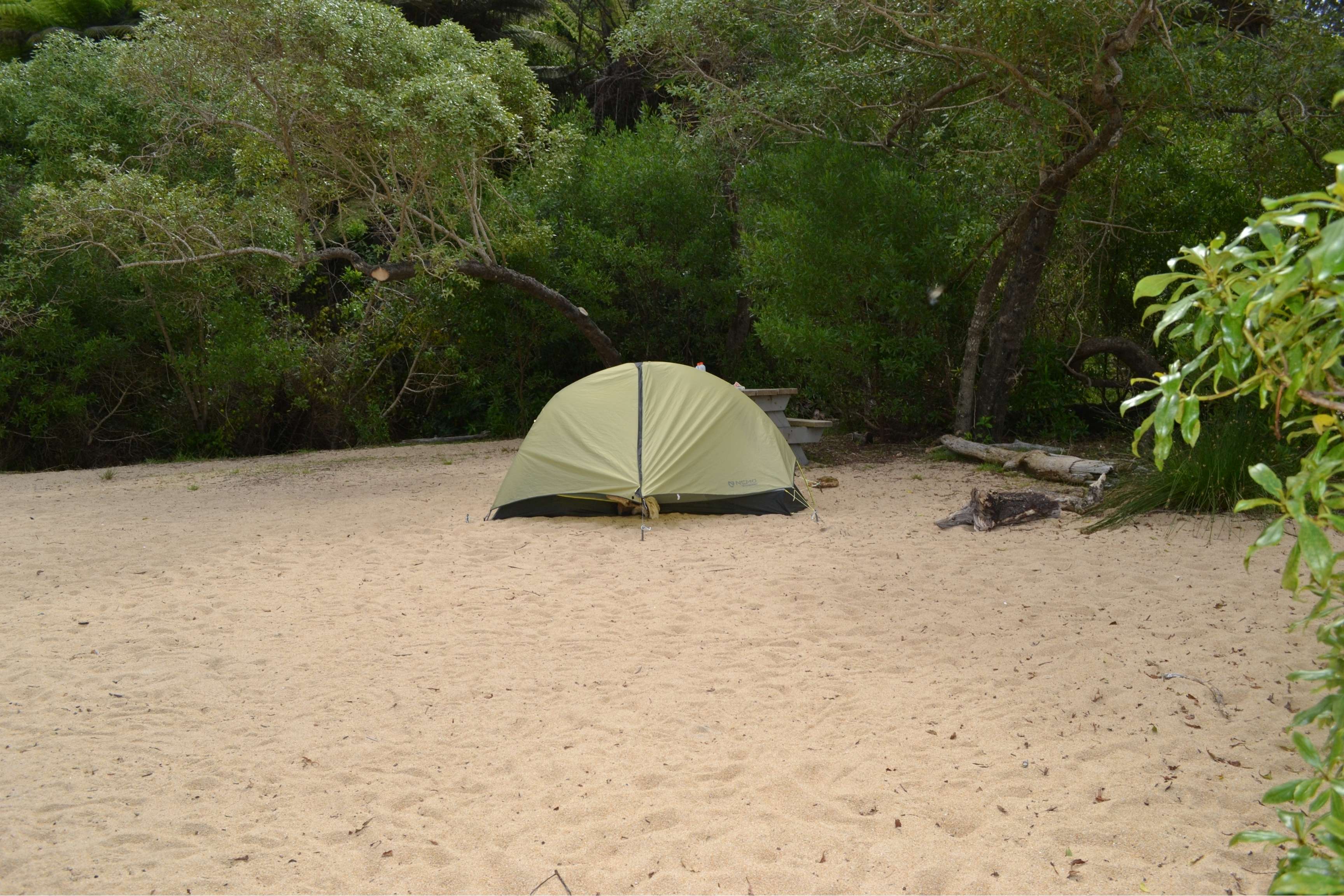 tent set up on tan campsite