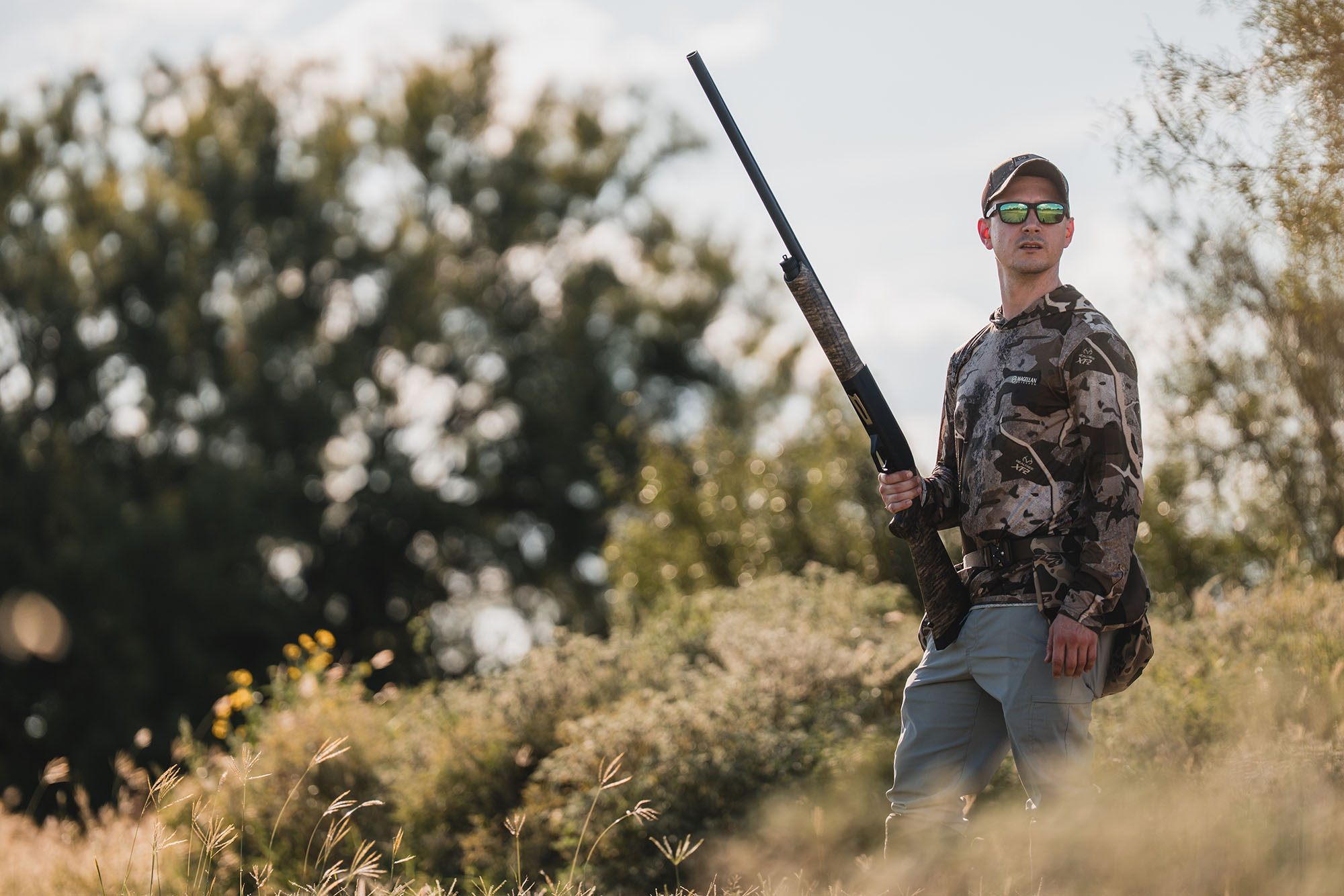 man hunting with shotgun