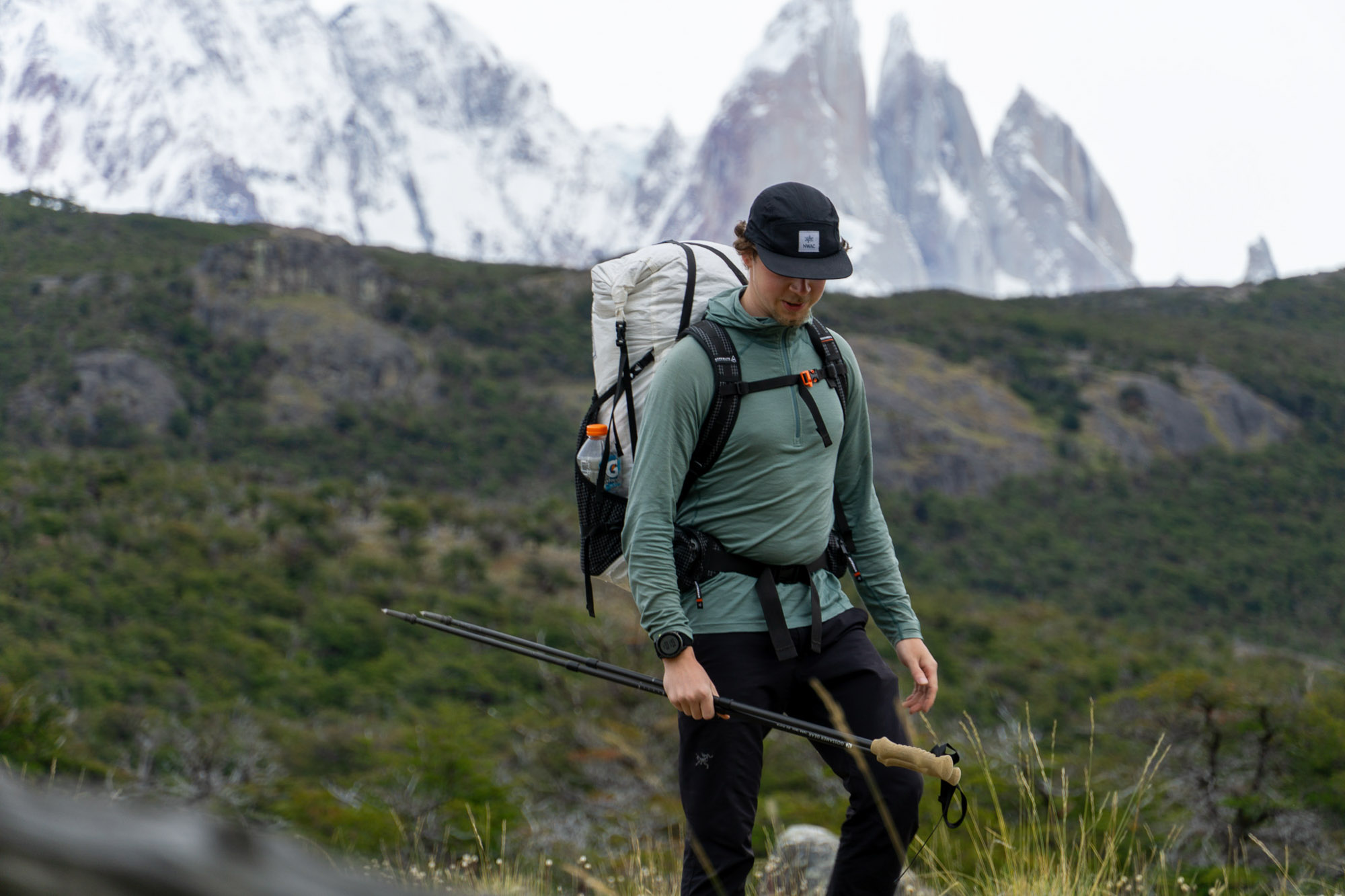 HIker carrying backpack in mountains