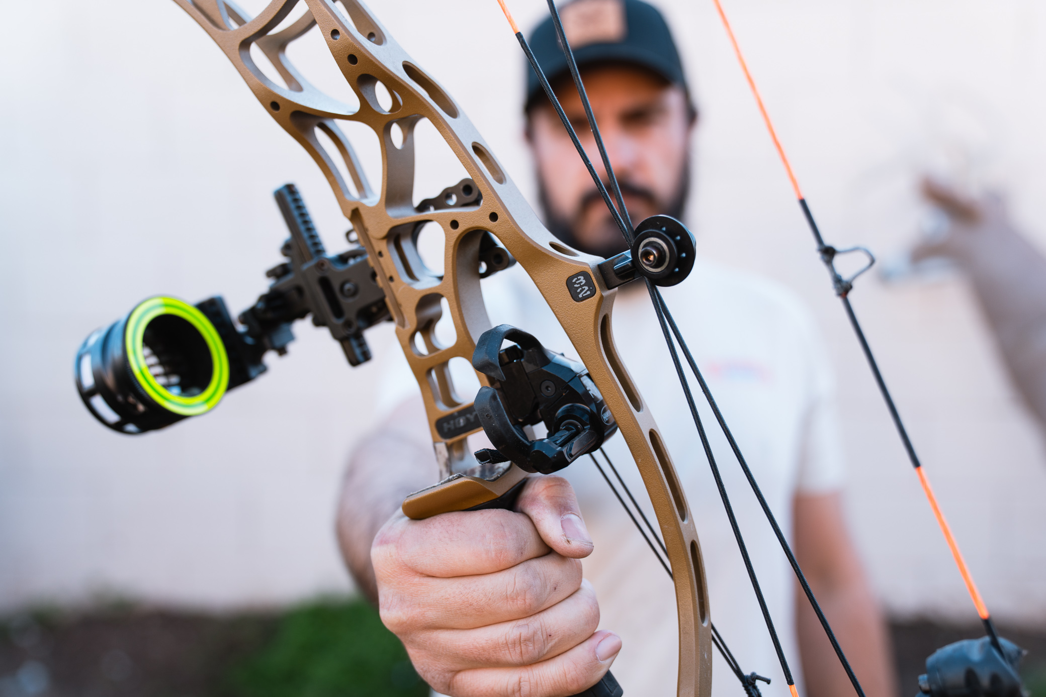 The Hamskea R7 Arrow Rest is visible on a compound bow held at full draw