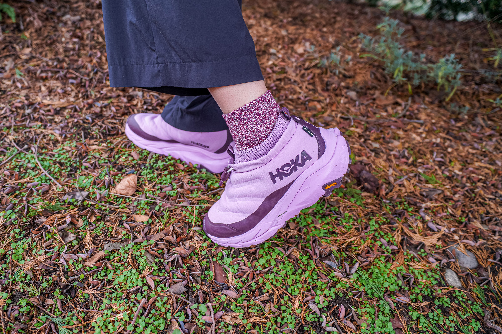 The HOKA x Halfdays Kaha 2 Frost Moc GTX is worn while walking on damp forest ground