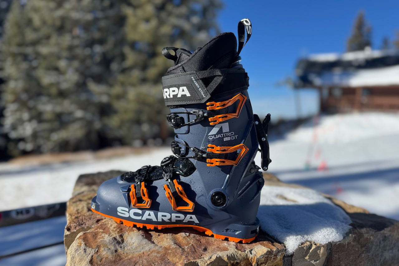 omplete side view of the Scarpa ski boot resting on rock