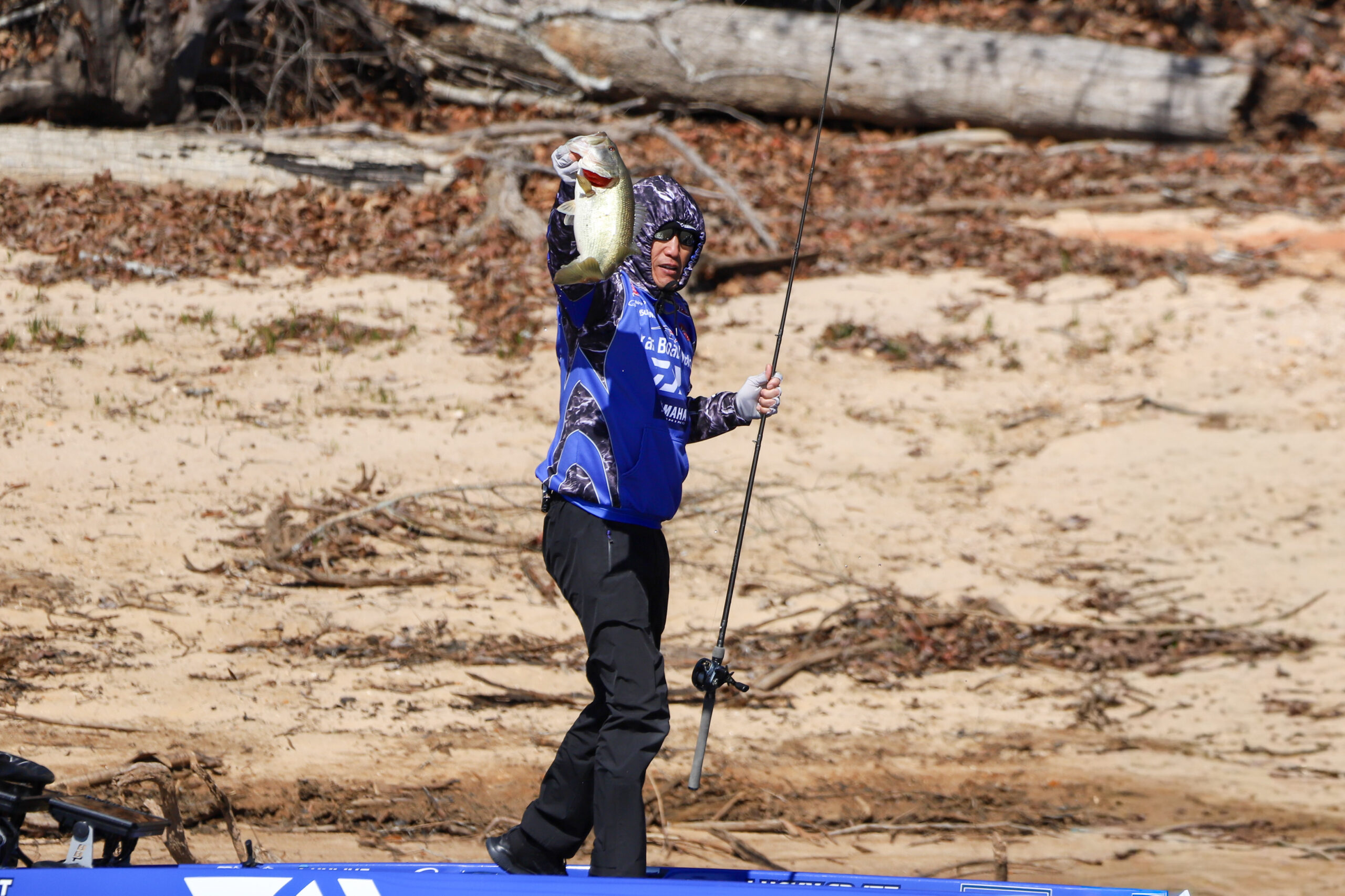 Takahiro Omori holding a bass at BPT Stop 2