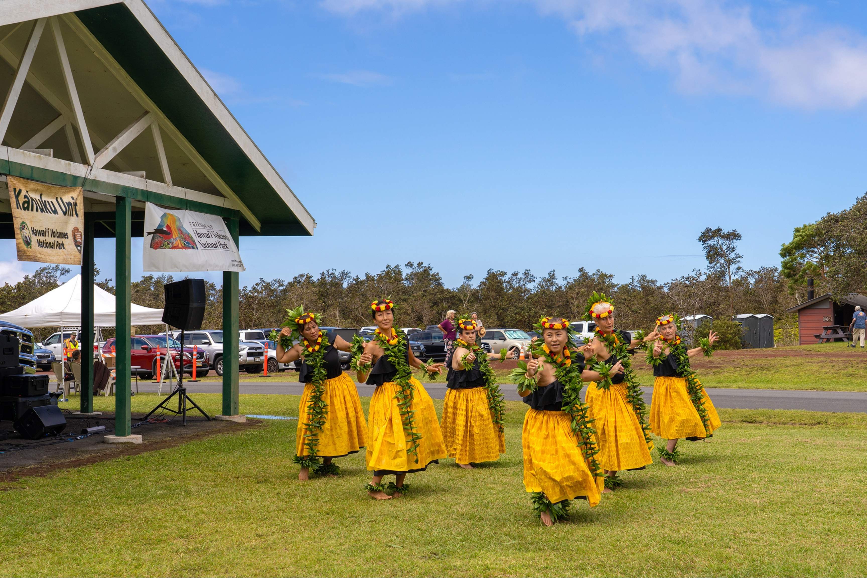 hula dancers perform outdoors