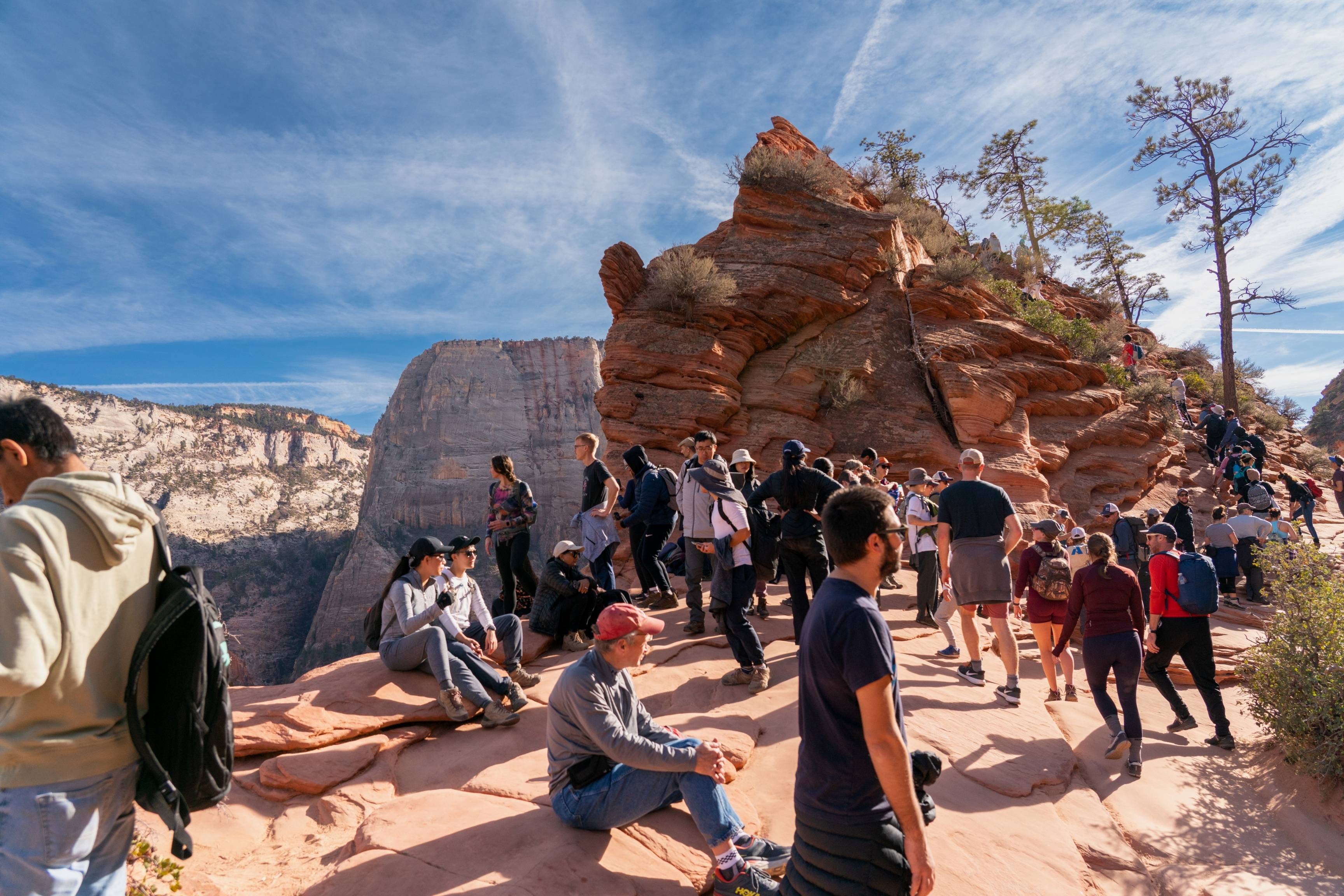 hikers gather on rocky trail