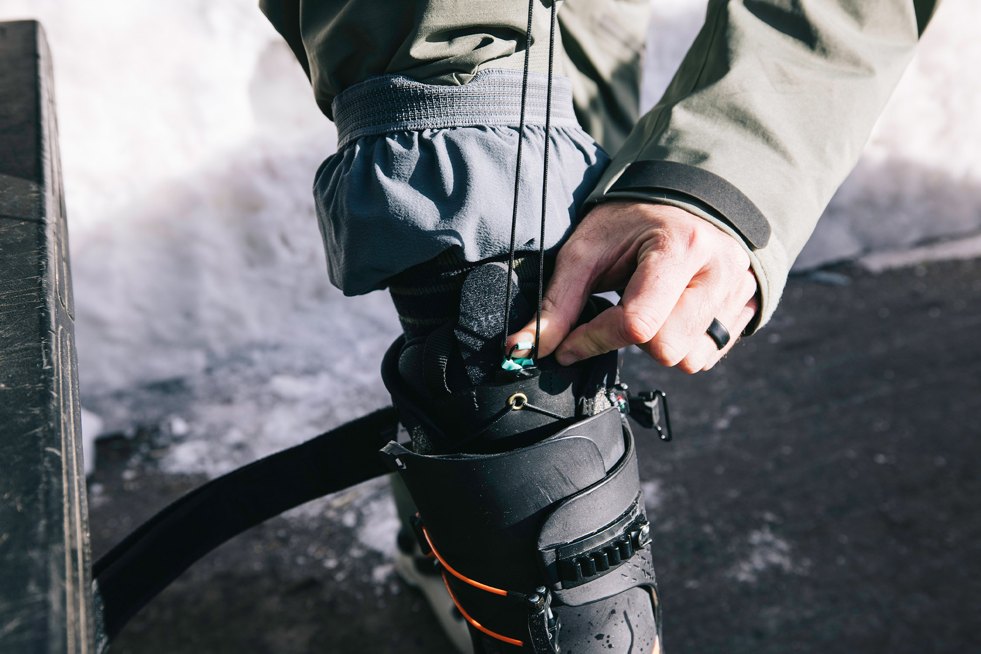 Adjusting the laces on a Zipfit Espresso liner inside a ski boot