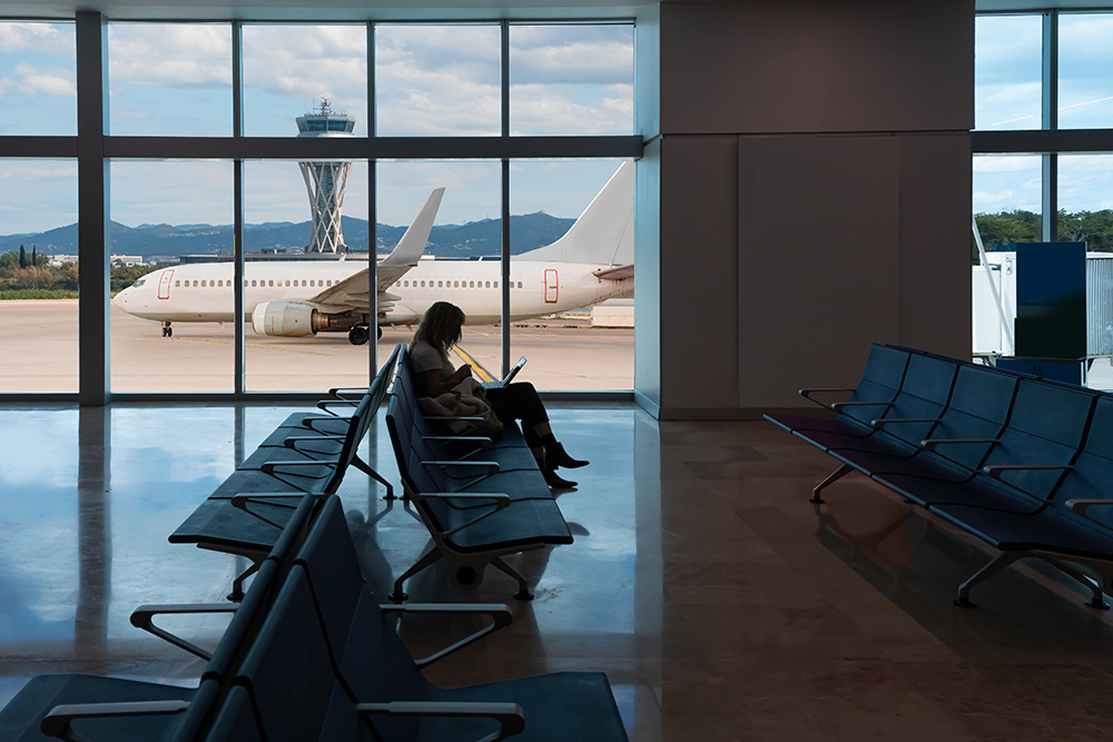 Silhouette,Of,Young,Woman,Working,On,Laptop,And,Waiting,For