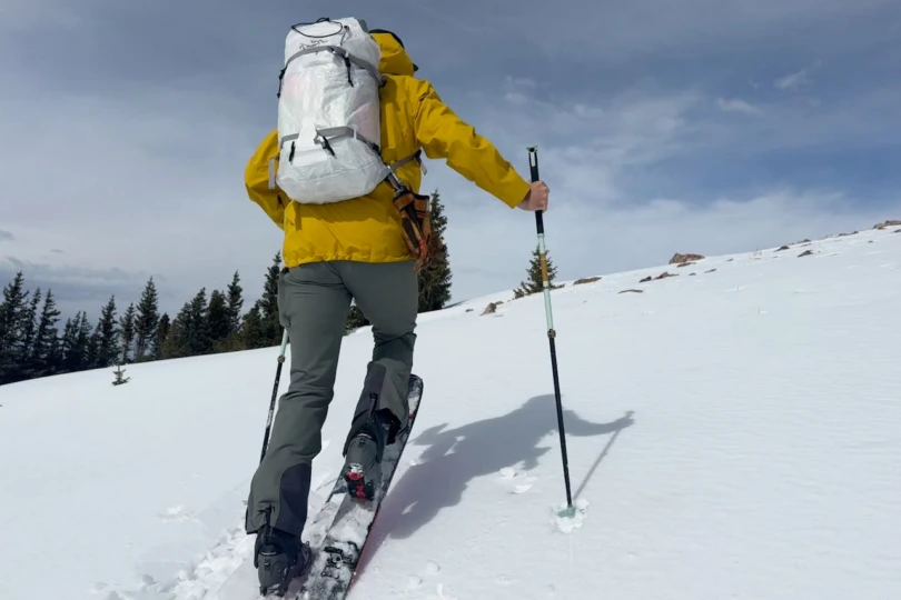 The Alpha SL backpack used while skinning uphill on a snowy backcountry slope