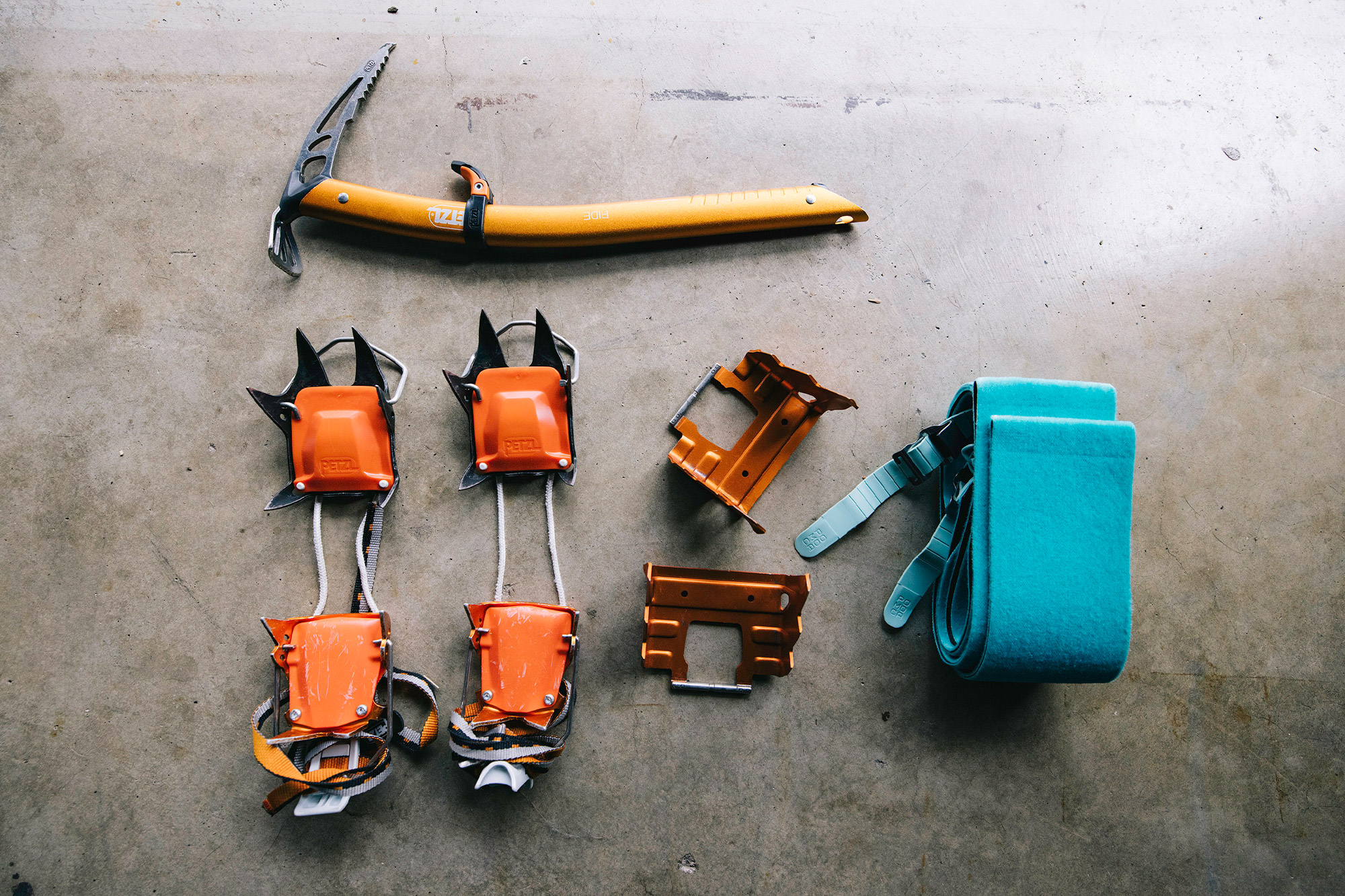 Ski touring accessories including crampons and skins for icy conditions