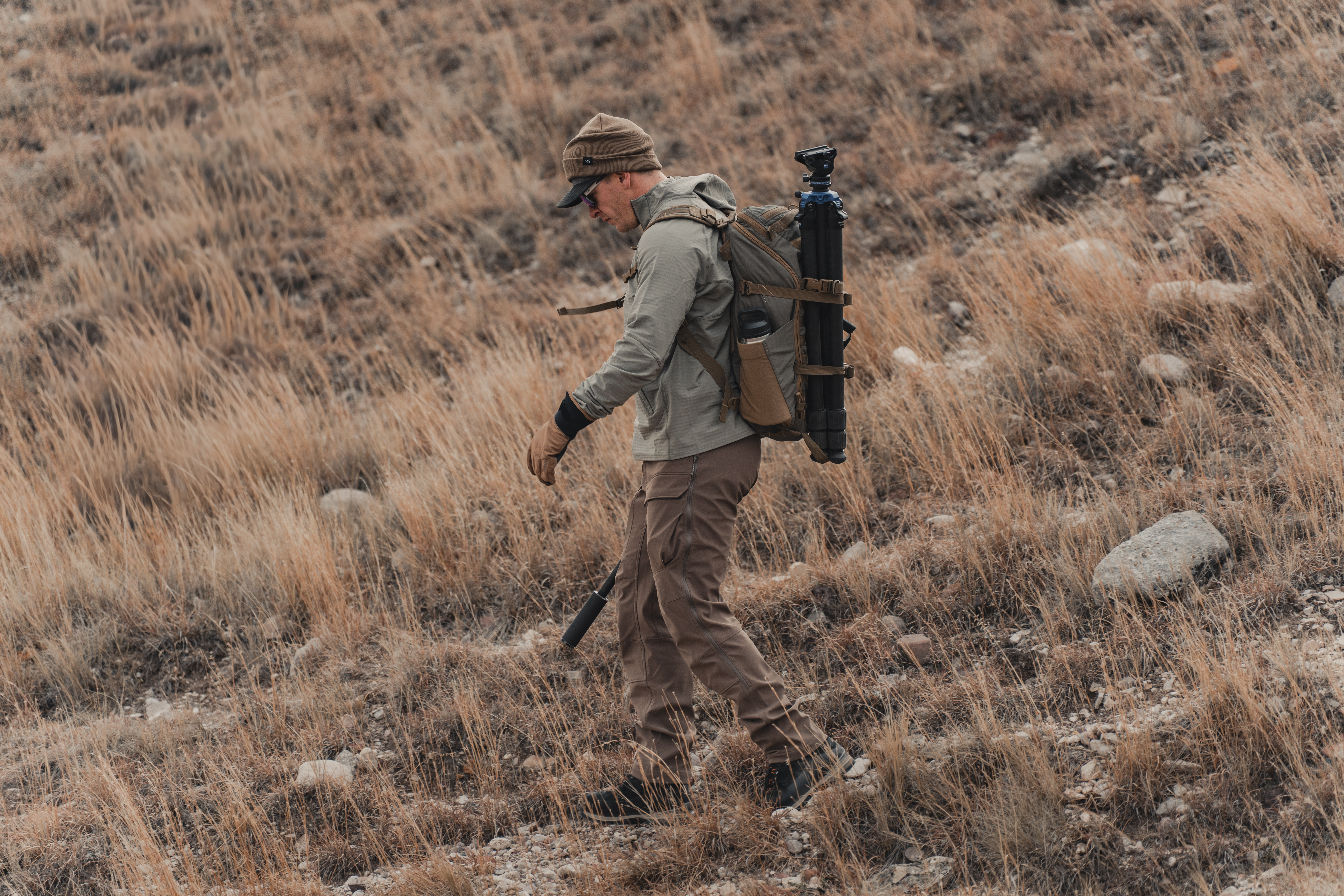 A hunter hiking in the Kifaru Crosslayer hoodie