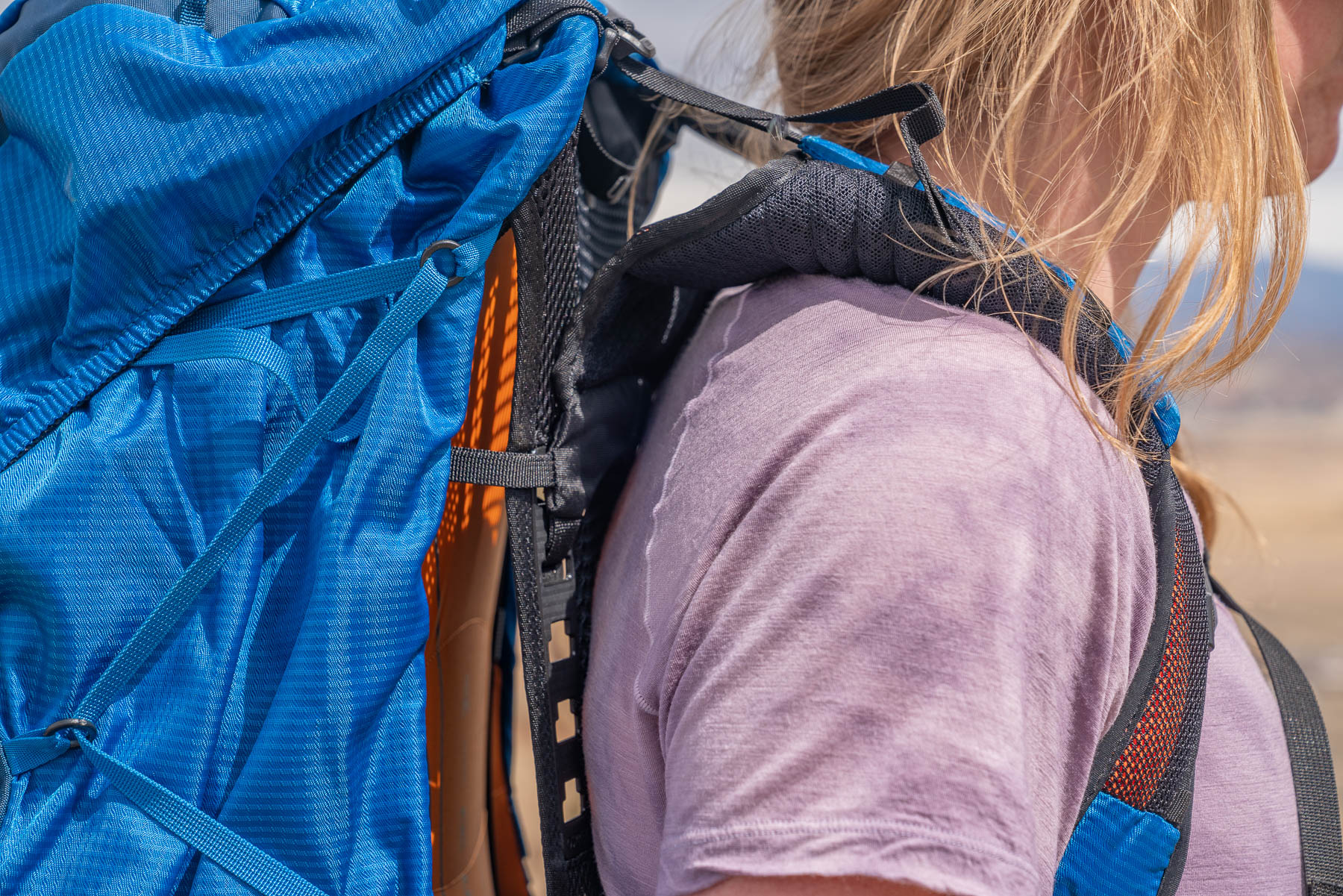 A shoulder strap on the osprey exos 58 backpacking pack
