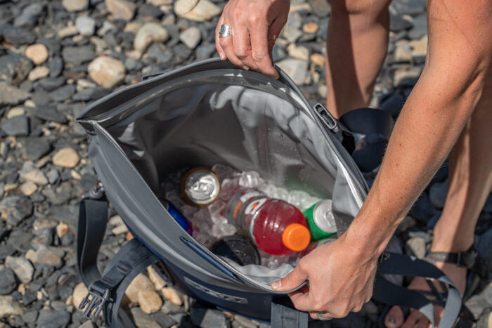 opening tote cooler to view drinks in ice 