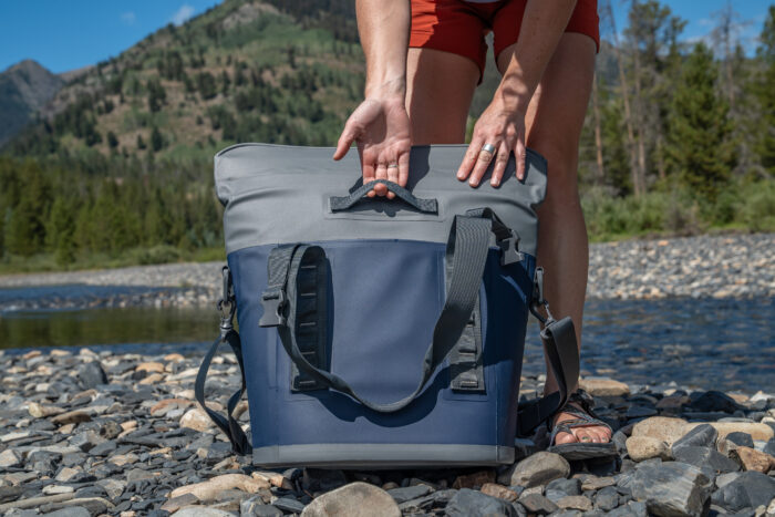 woman pulling grab handle with hand